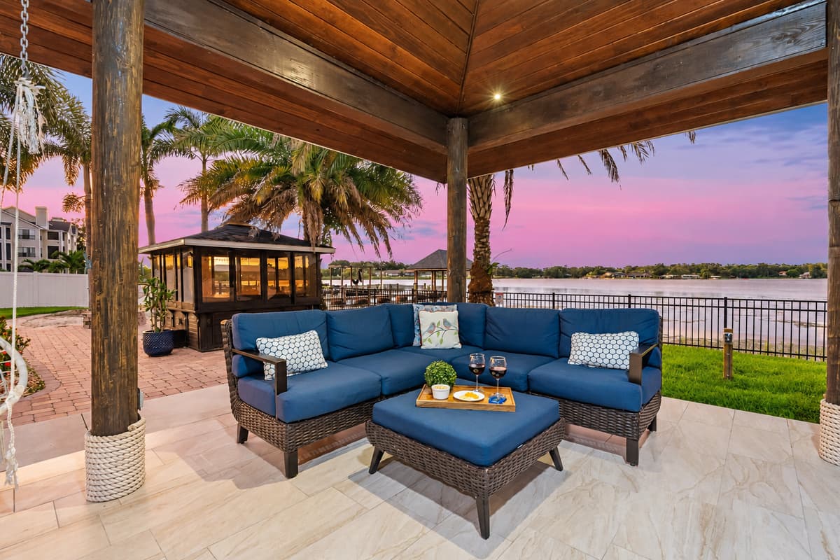 As the sun sets over the water, this open-air pavilion transforms into the perfect spot for dining, lounging, and entertaining.