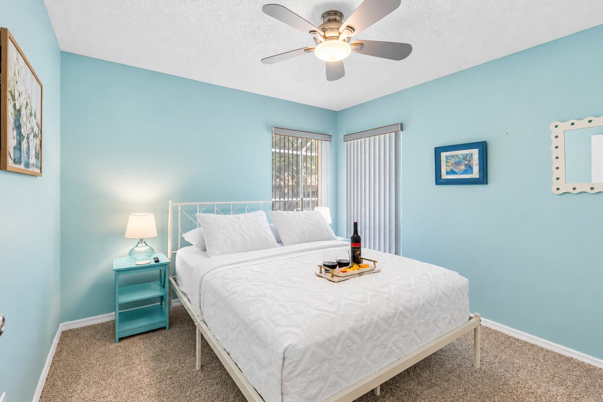 This inviting bedroom features a plush queen-size bed, offering a spacious and cozy sleeping experience for solo travelers, couples, or anyone seeking a peaceful night's rest.