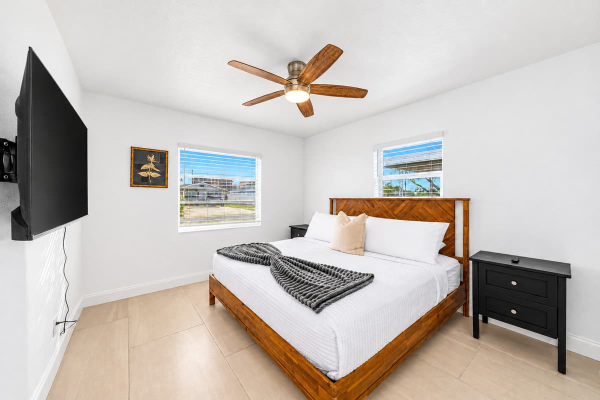 A guest room that feels like the good hotel room. Soft bedding, a reading chair by the window, and quiet morning light. Close the door and the trip finally slows down to your pace.