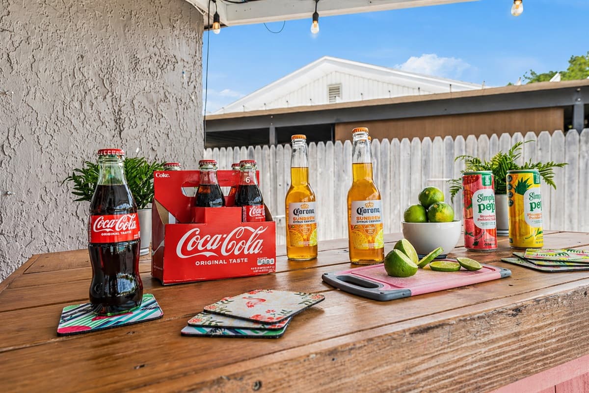 Outdoor bar setup with drinks and accessories for a fun, resort-style experience. (Items shown for staging purposes only)