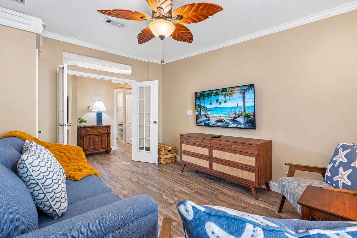Designed for comfort and versatility, this bedroom includes a queen-size pullout sofa bed, making it ideal for additional guests. Thoughtful furnishings and calming neutral tones provide a peaceful place to unwind.