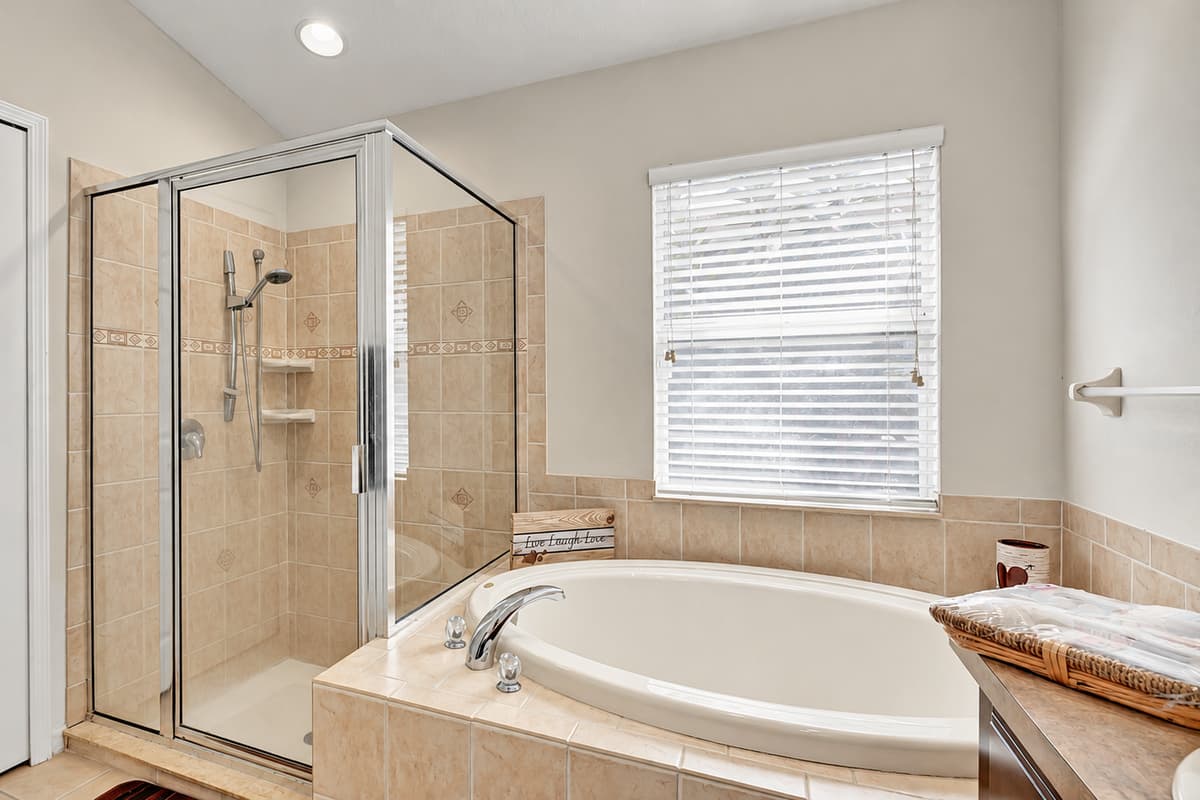 Whether you're starting your day with an invigorating shower or unwinding in a soothing bath, this ensuite is your personal retreat.