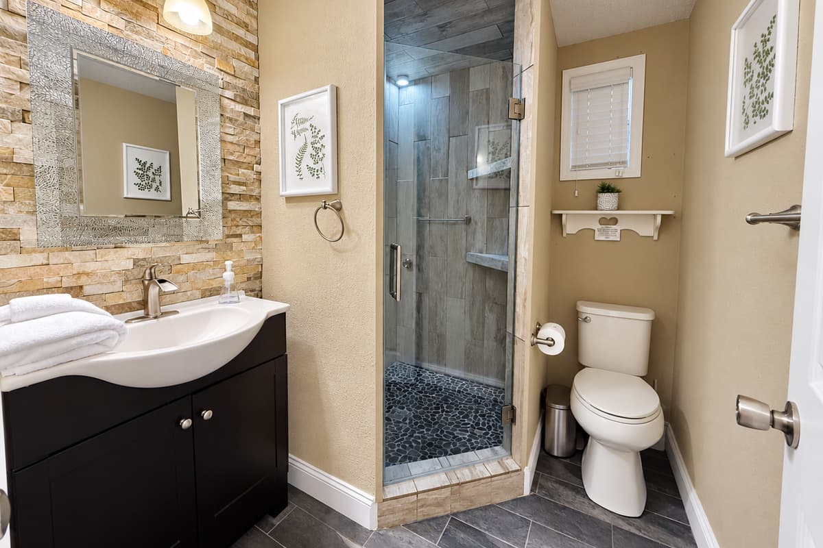 From the elegant wall textures to the stylish vanity and open shelving, every detail has been designed with your comfort in mind.