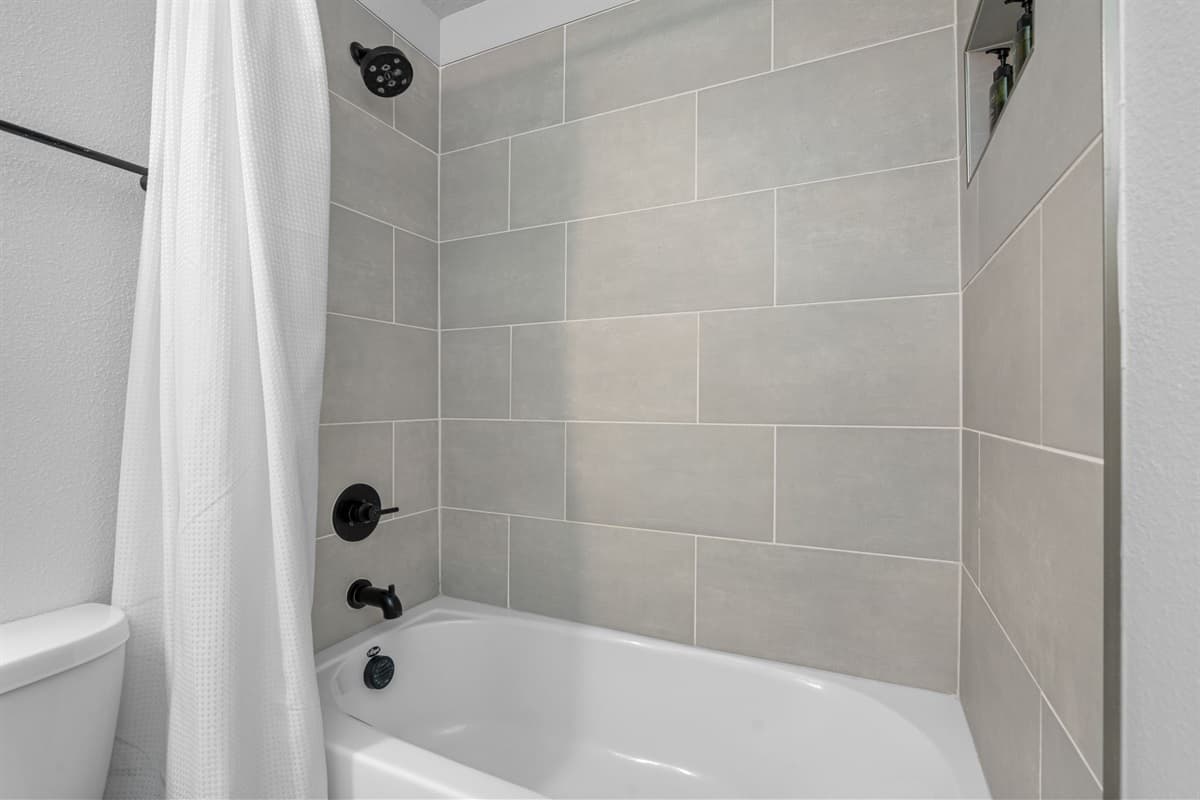 Step into the world of indulgence and sophistication with the stylish bathrooms awaiting you in this exquisite residence.