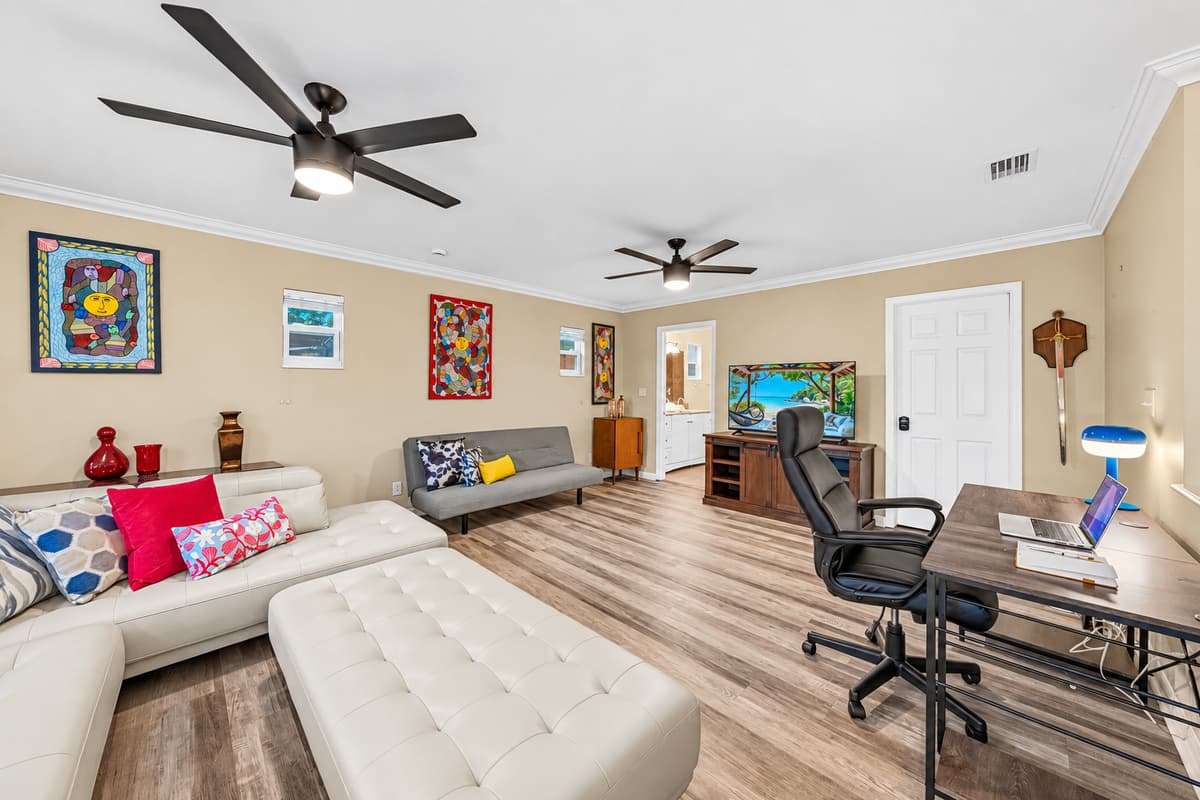 Open living and workspace combo with stylish furnishings and plenty of room to spread out comfortably.