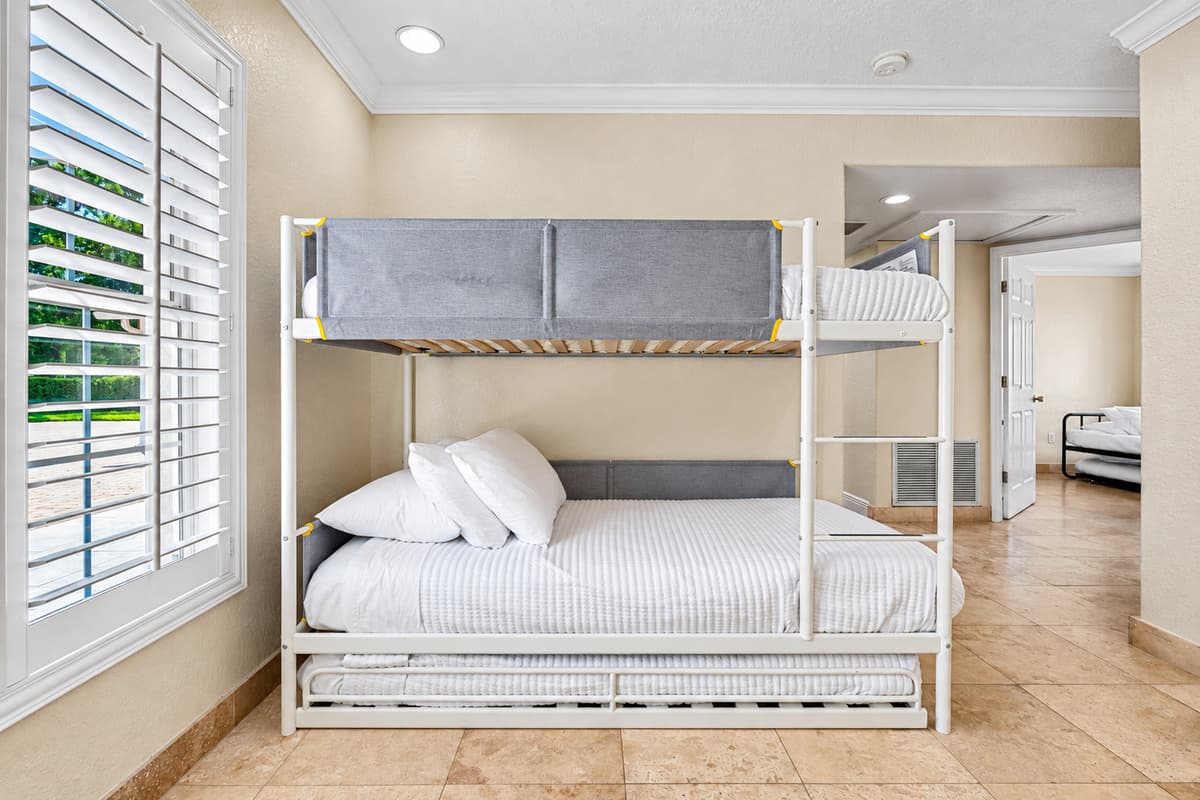 This bedroom is a cheerful and versatile space that’s perfect for children, teens, or additional guests needing a comfortable and convenient place to sleep.