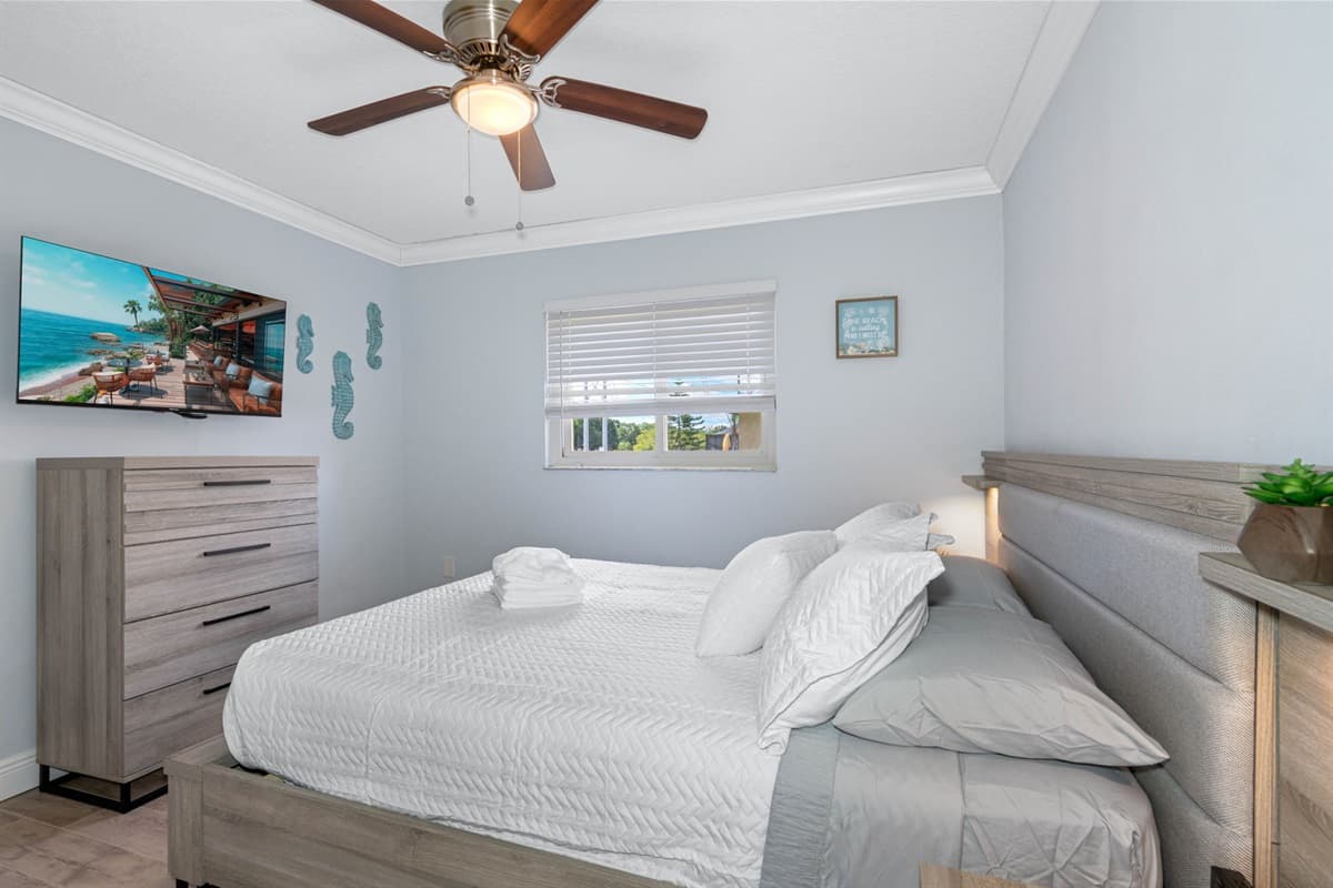 The room's thoughtful layout and stylish decor add to its charm, making it a delightful place to rest and rejuvenate.
