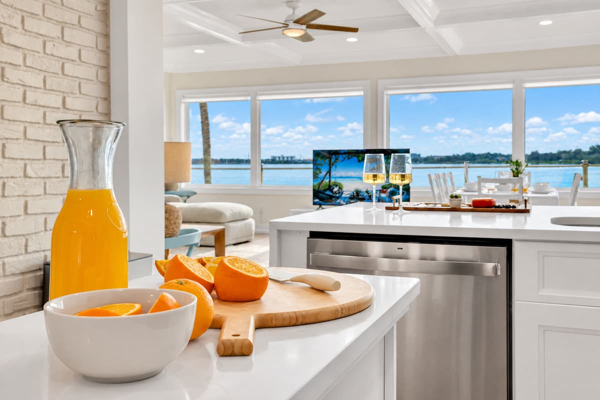 Fresh juice and a waterfront kitchen. Oranges, juice and a sunny kitchen with water views. A simple morning that feels like a getaway.