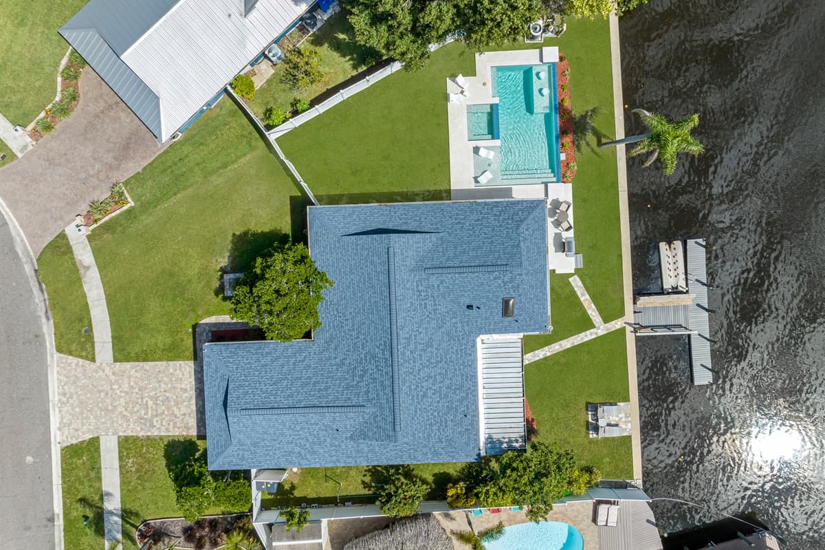 Aerial top view of our immaculate property showcasing the stunning heated pool and lounge area at the back of the property. Do you like what you see? Ask us questions and send us an inquiry as soon as possible!