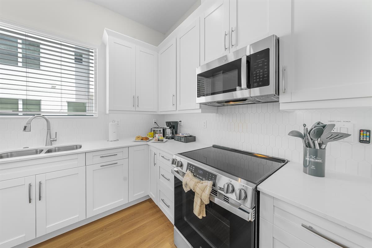 Everything you need to cook your favorite meals: full-size stove, refrigerator, and generous counter space.