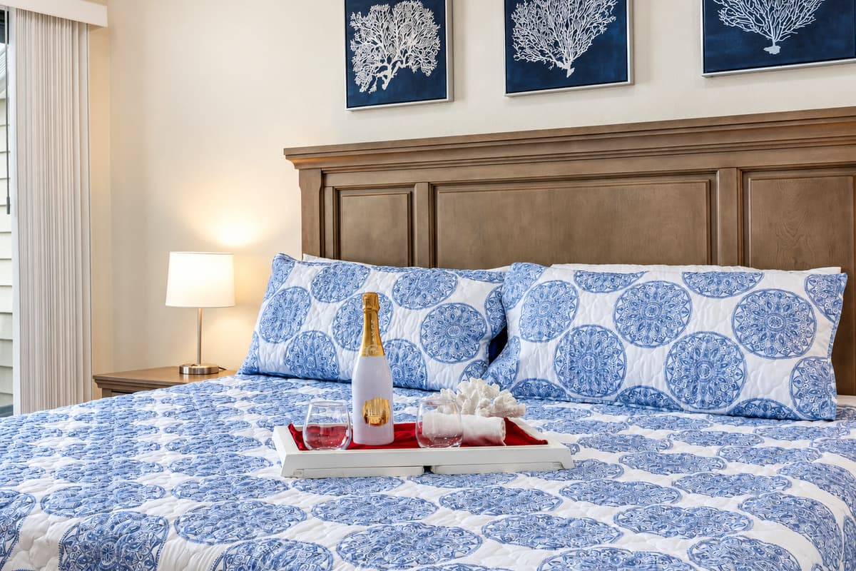 The king-size bed invites you to indulge in a night of serene sleep, enveloped in soft linens and plush pillows.