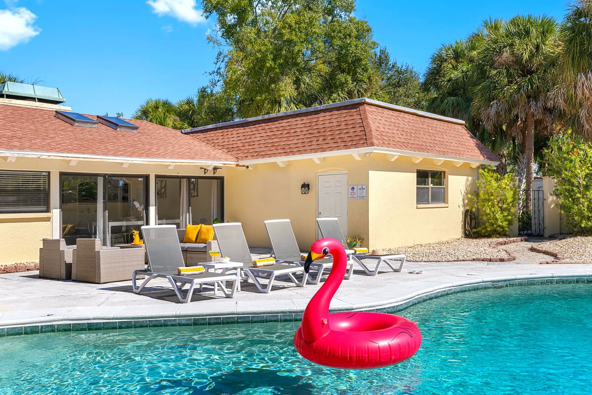 Kick back poolside with a drink in hand. This beautifully designed outdoor space features sleek loungers, a dining area, and a BBQ — your private resort awaits.
