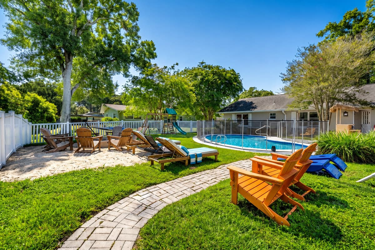 Fire pit on one side, pool on the other, a path connecting them. The evening moves without anyone deciding.