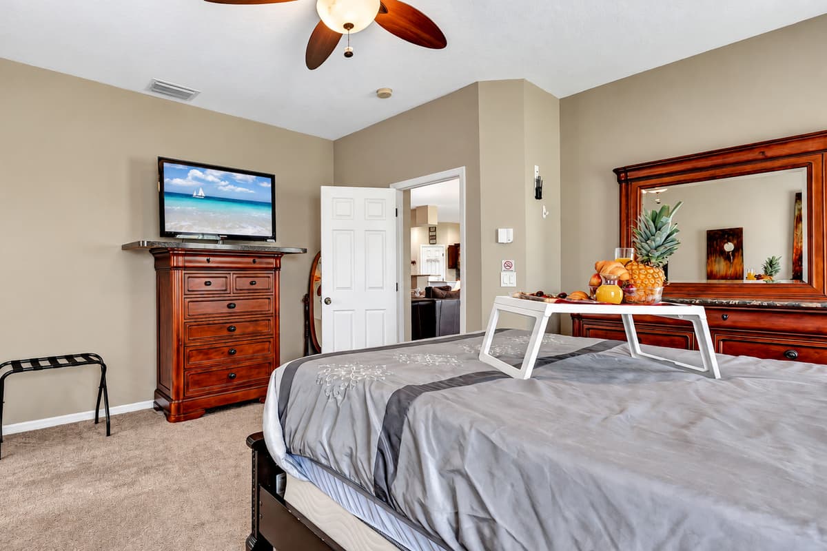 Natural light cascades through the windows, enhancing the room's airy ambiance.