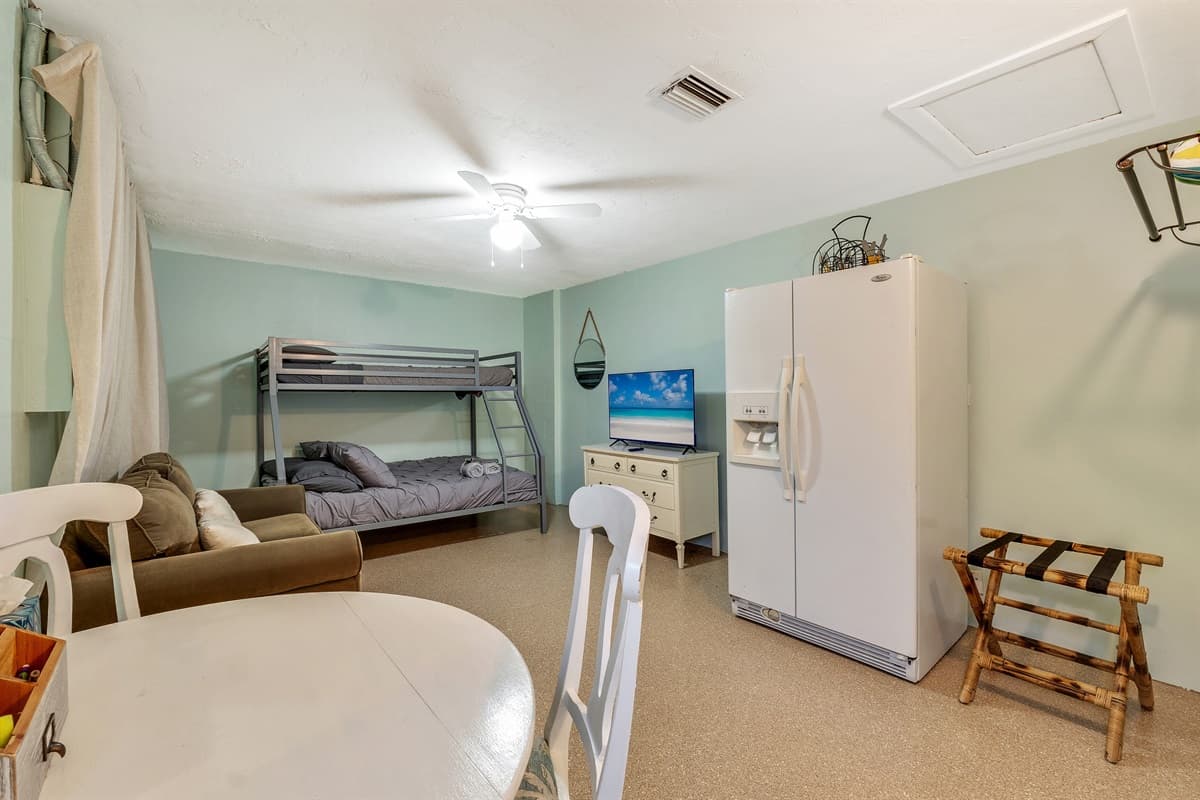 The centerpiece of the room is the cozy twin-size bed, promising a haven of relaxation and rest.