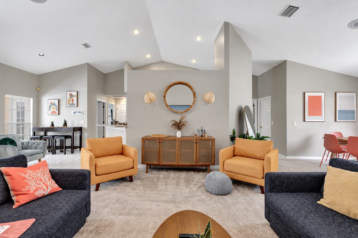 Accompanying the sleek seating options in our living room are charming beige single couches, adding a touch of elegance to the overall ambiance.