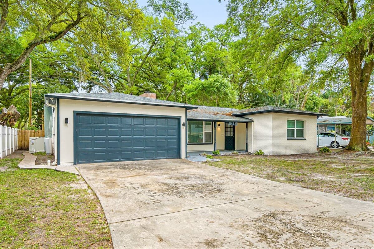 The left side area of the house showcasing the driveway to the garage. We have a spacious and secured driveway where you can park your cars. Send us a message now!