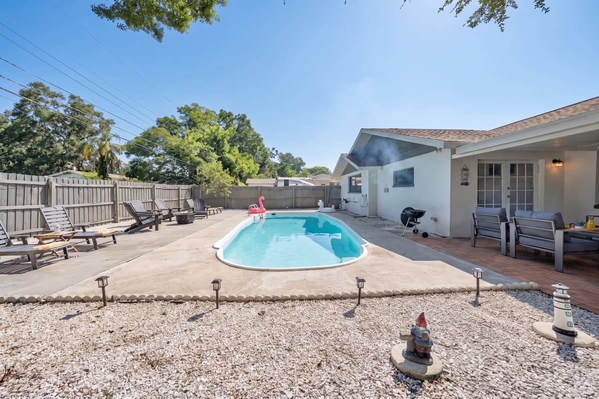 Florida sunshine does all the heating here — the pool is unheated, so it's at its best from spring through fall, when the water sits warm all day long and the only real decision left is who gets to jump in first.