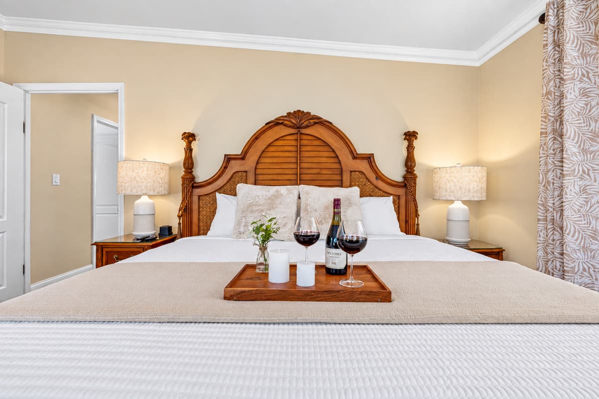 Soft ambient lighting and decor pieces enhance the room’s relaxing coastal aesthetic.