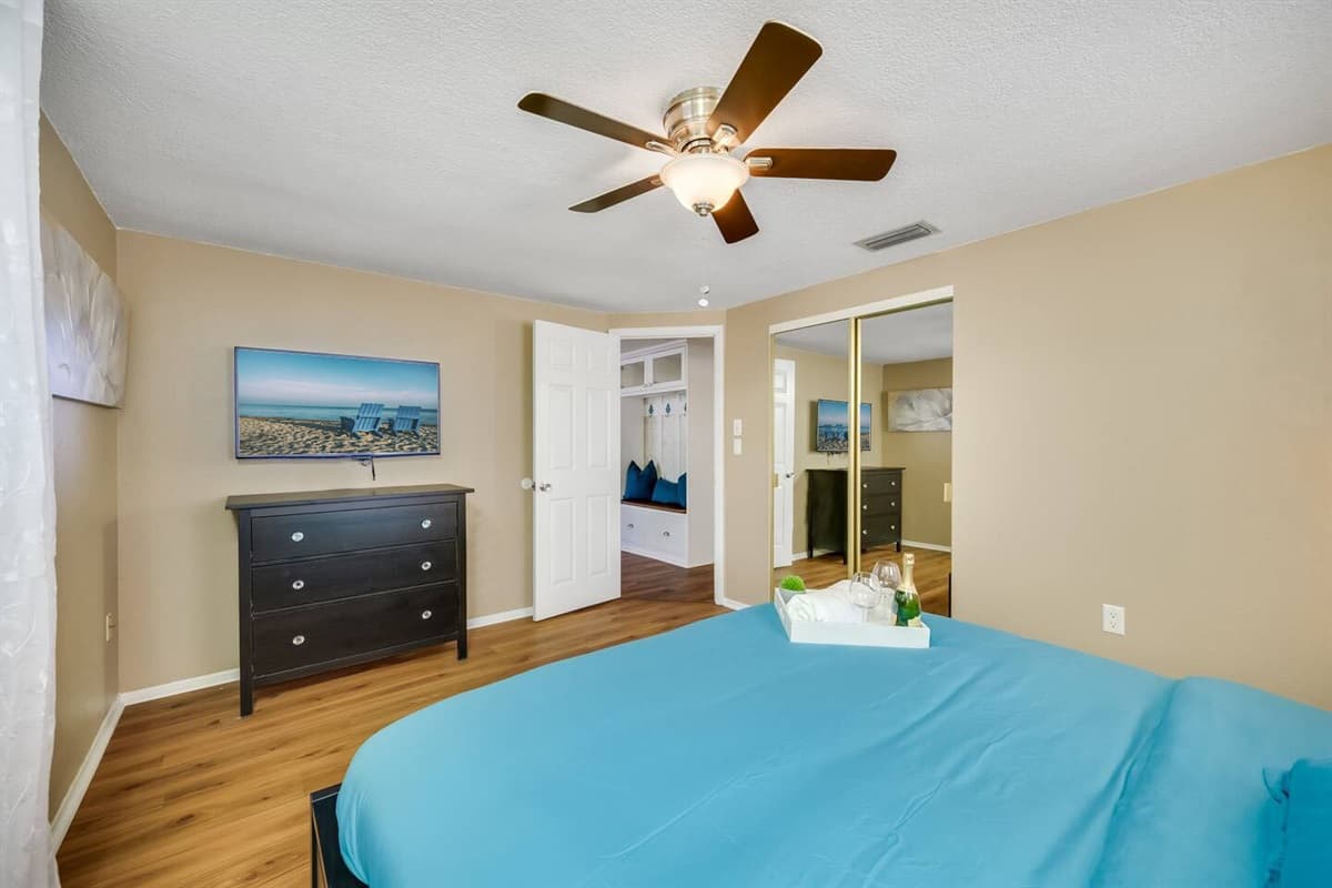 Feel safe and comfortable in this impeccable bedroom that has a queen sized bed, closet and drawers, and its own TV! Its like sleeping in your home away from home!