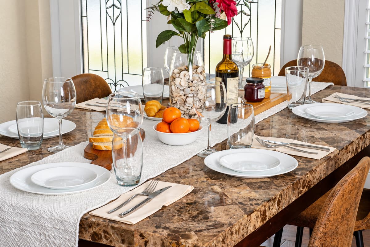 The marble-look tabletop and six comfortable chairs offer both style and practicality for everyday dining or special occasions.