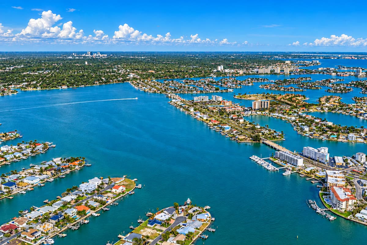 Scenic aerial view of the beautiful white-sand beach and crystal-clear Gulf waters.