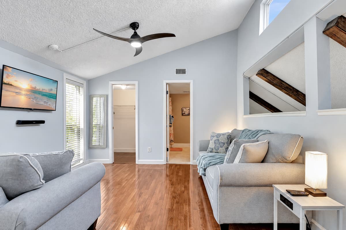 Immerse yourself in comfort with the added convenience of a sleeper sofa in this bedroom, providing the perfect blend of relaxation and functionality.