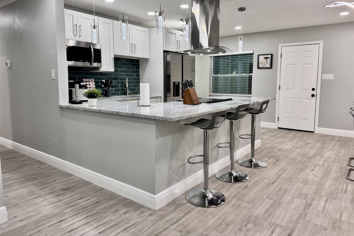The kitchen flows seamlessly into the dining area, creating a warm and inviting atmosphere for gathering and enjoying meals.