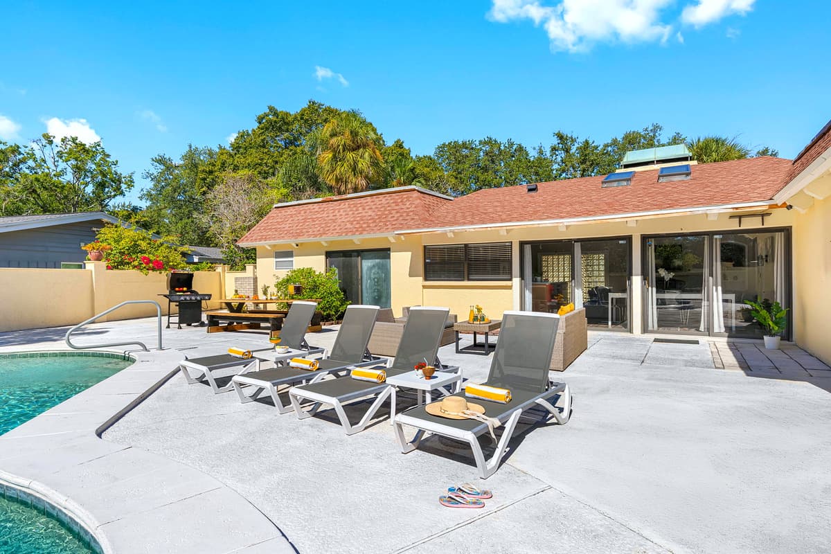 Host, relax, or celebrate — this backyard has it all: plenty of seating, a grill, and a refreshing pool to keep everyone happy.