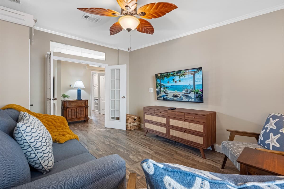 Designed for comfort and versatility, this bedroom includes a queen-size pullout sofa bed, making it ideal for additional guests. Thoughtful furnishings and calming neutral tones provide a peaceful place to unwind.