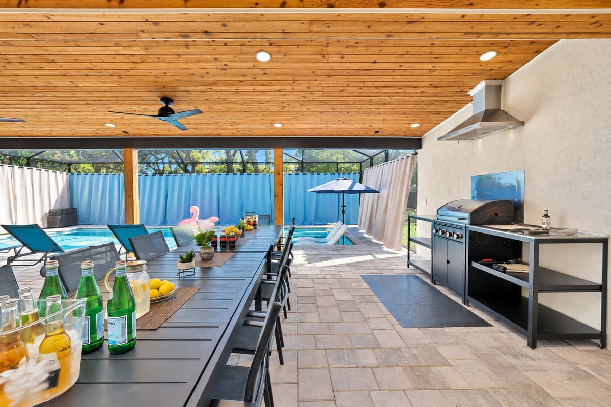 Drinks on the table, grill fired, and the pool a step away.