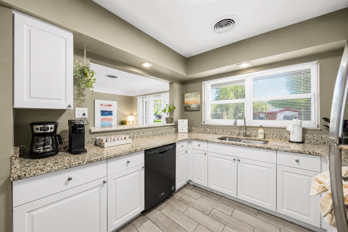 Spacious kitchen featuring plenty of counter space, natural light, and modern appliances.