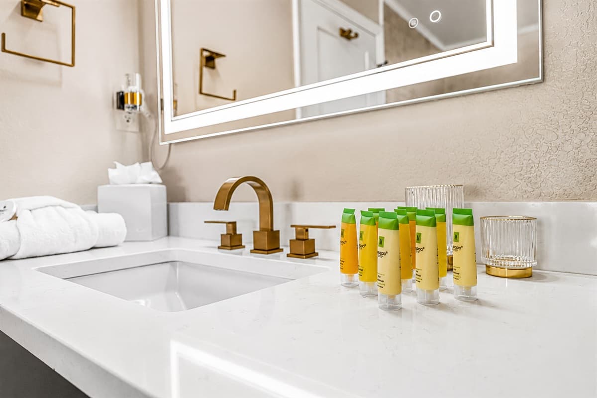 Stylish bathroom vanity with premium toiletries, modern fixtures, and bright contemporary design.