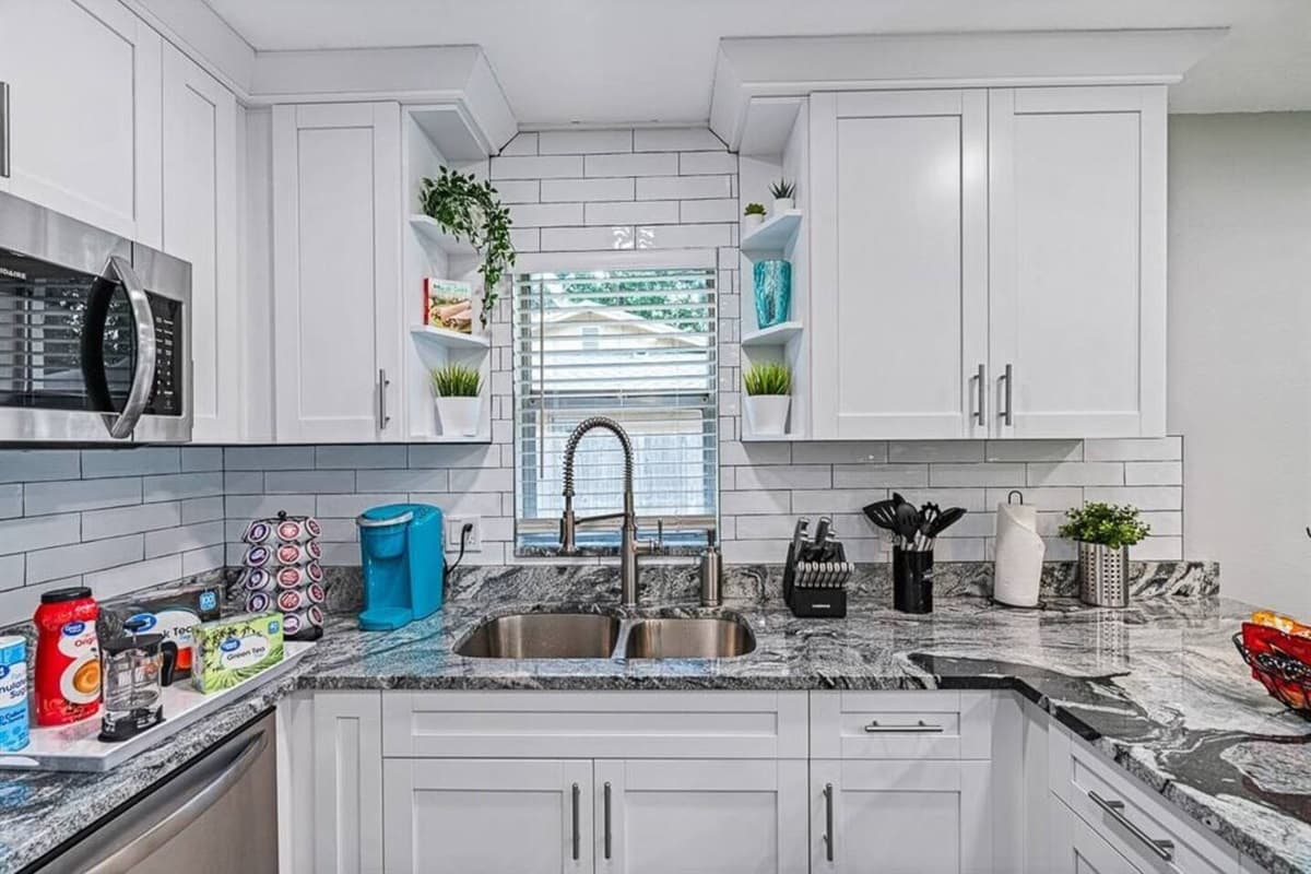 Our fully equipped kitchen has white, beautiful cabinets and drawers for storage. It has coffee/ tea counter as well, so never worry coffee/ tea lovers out there! If you love what you see so far, send us an inquiry now!