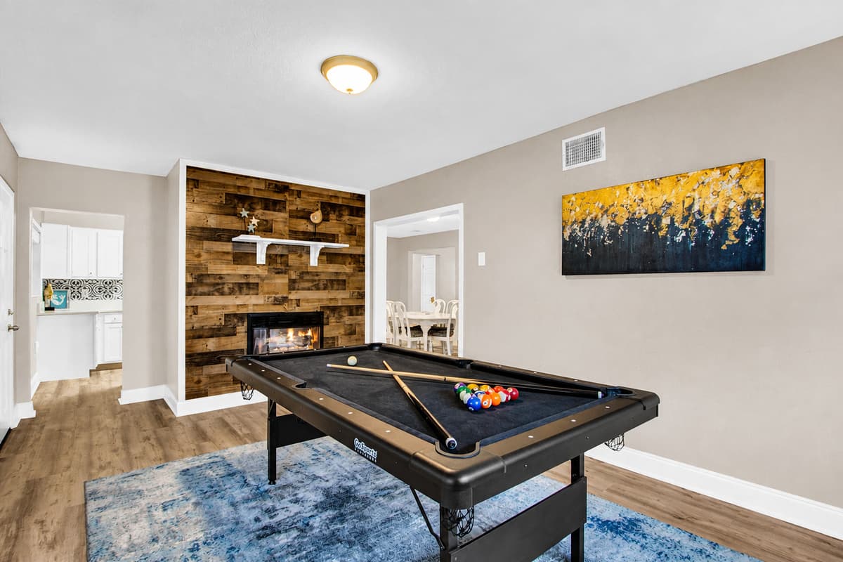 Our sleek pool table, inviting you to cue up for a friendly match or showcase your trick shot prowess.