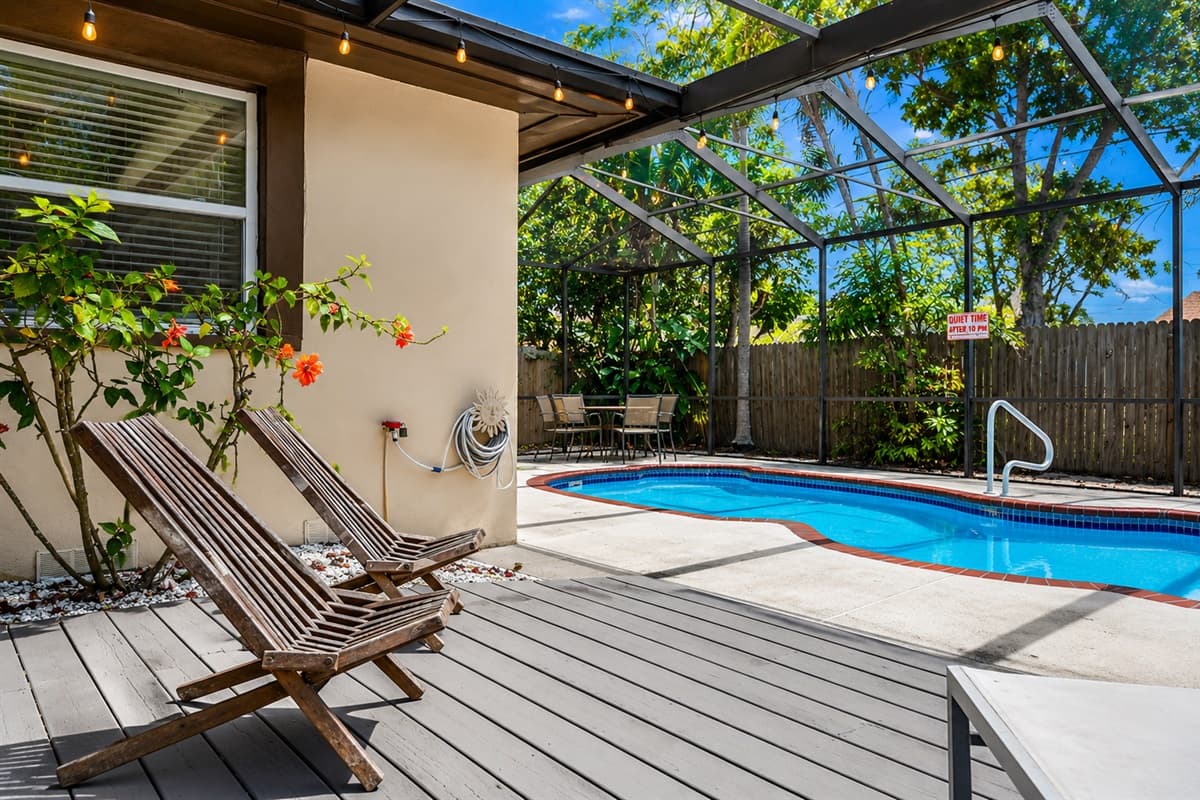 Relaxing lounge area beside the pool, perfect for soaking up the Florida sunshine.