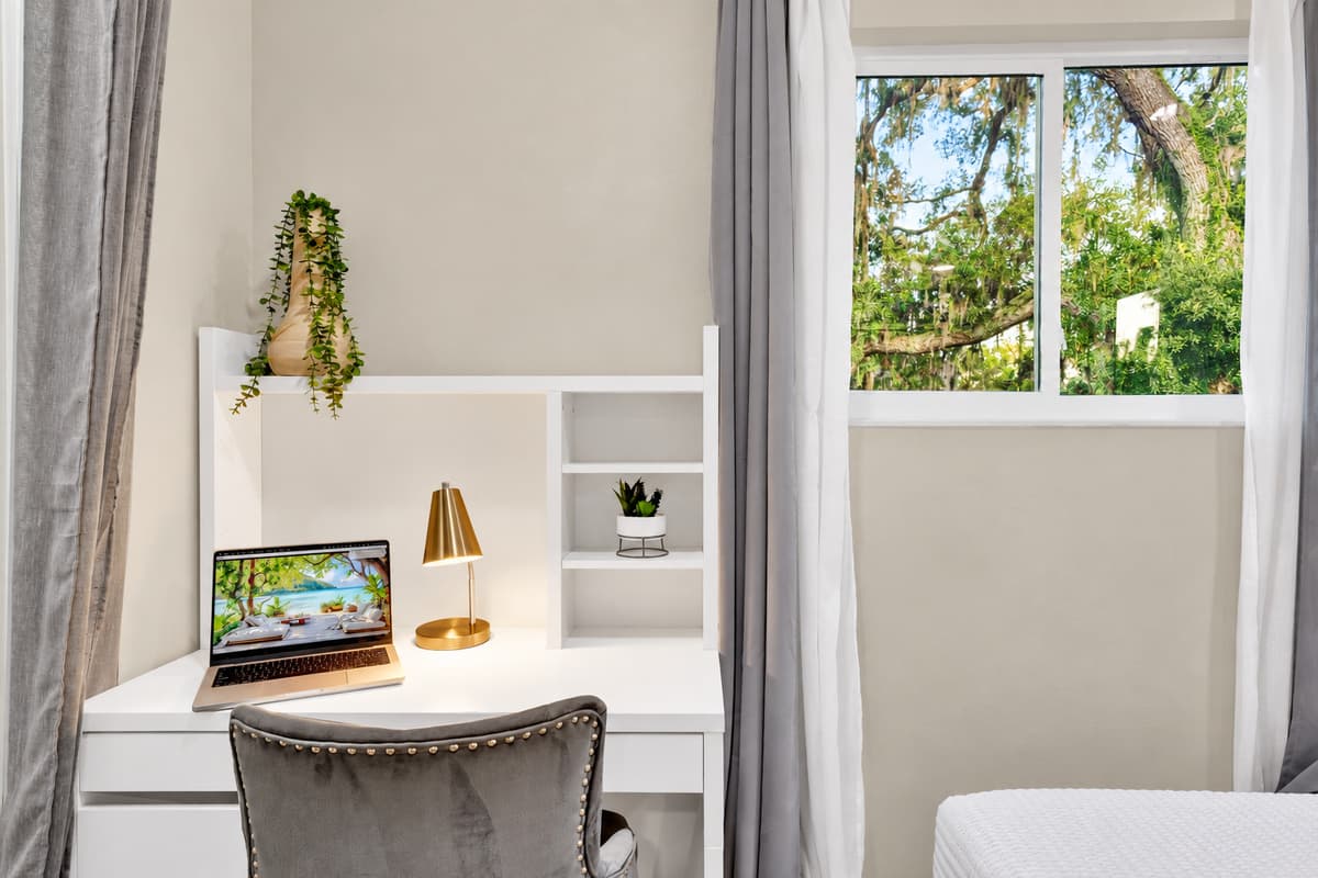 Take the call, then take the rest of the week off. A real desk with a proper chair and daylight from the window, so the one person still working doesn't lose the whole morning to it.