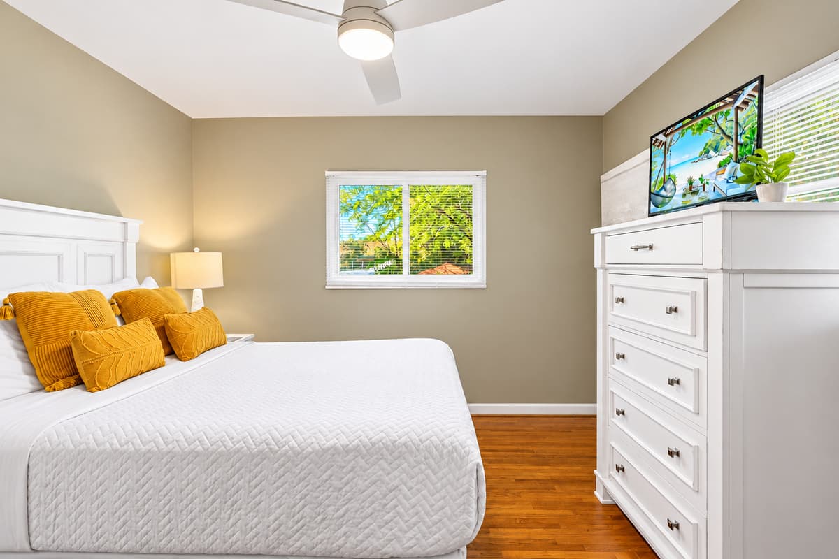Bright and inviting bedroom with modern furnishings, natural light, and a relaxing atmosphere.