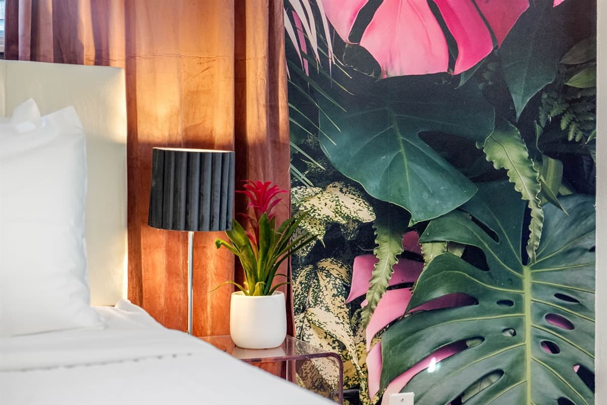 A touch of coastal grandeur surrounds the king-size bed.