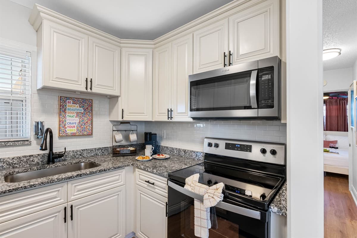 Equipped with state-of-the-art appliances, ample storage, and a thoughtfully curated selection of cookware.
