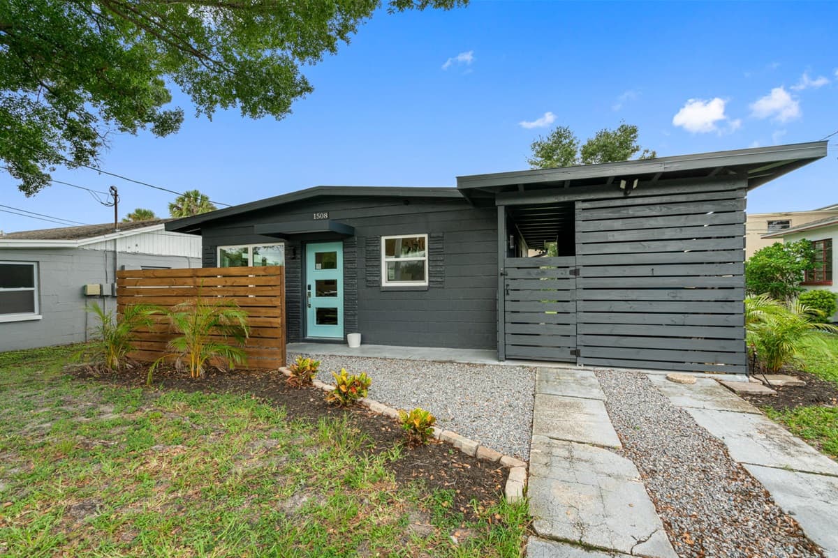 This beautiful home boasts a stunning exterior that seamlessly blends modern design with classic charm.