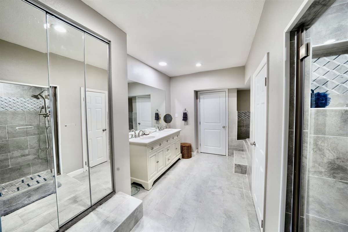 The walk-in shower is designed for convenience with its spacious enclosure, rainfall showerhead, and modern fixtures, ensuring an invigorating start to your day or a refreshing retreat after your adventures.