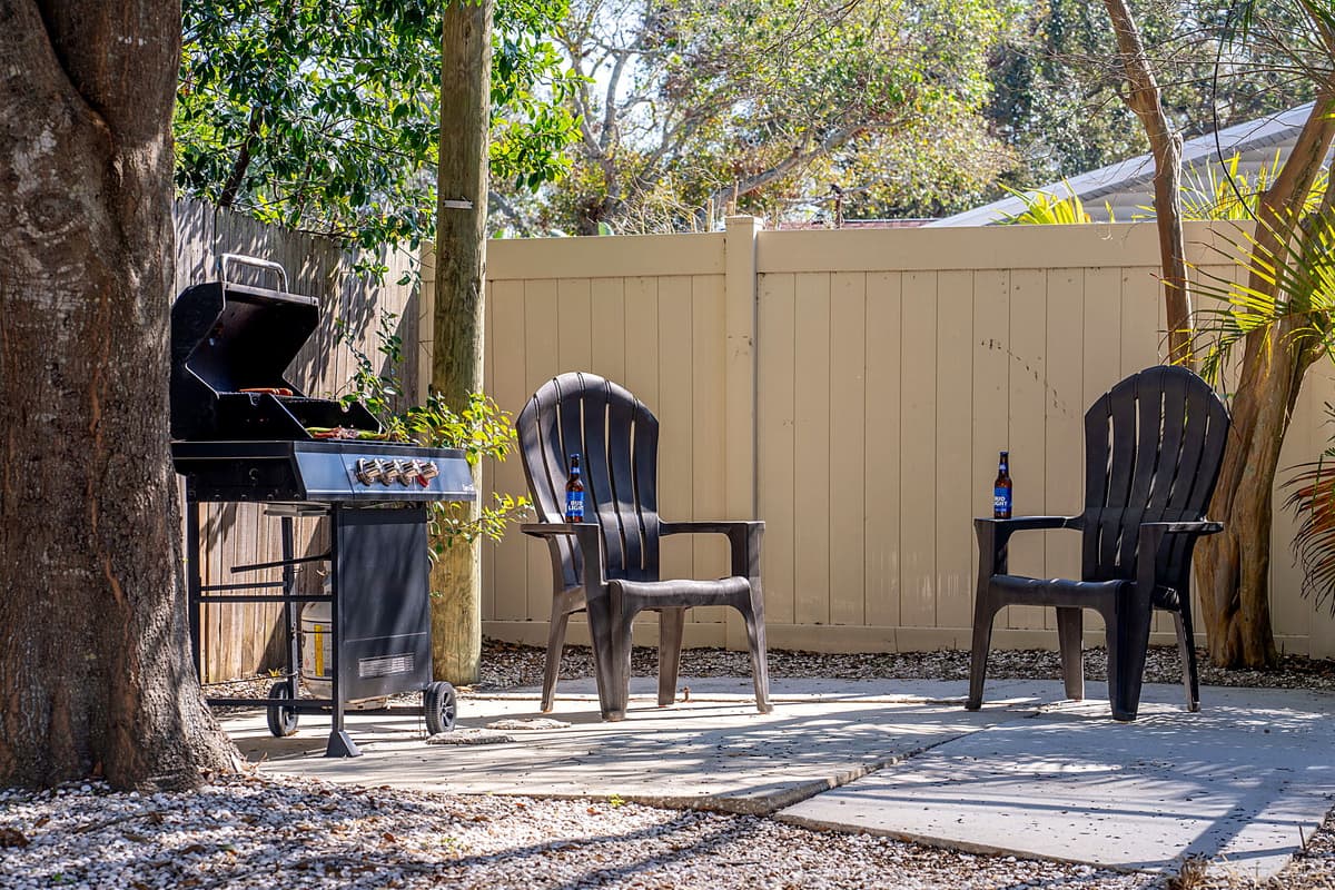 Positioned conveniently near the sparkling pool, the grill area is complemented by ample seating, ensuring that everyone can relax and socialize while the food is being prepared.