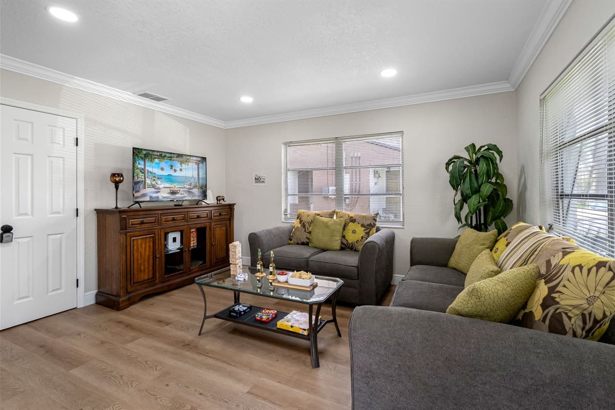 This inviting space is thoughtfully styled with a minimalist yet cozy aesthetic that immediately puts you at ease.