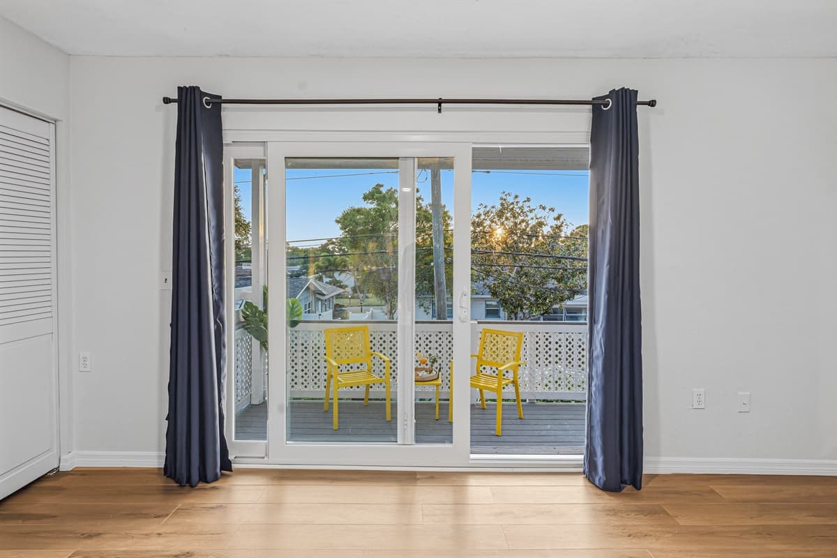 Private balcony access with seating area—perfect for morning coffee or evening relaxation 