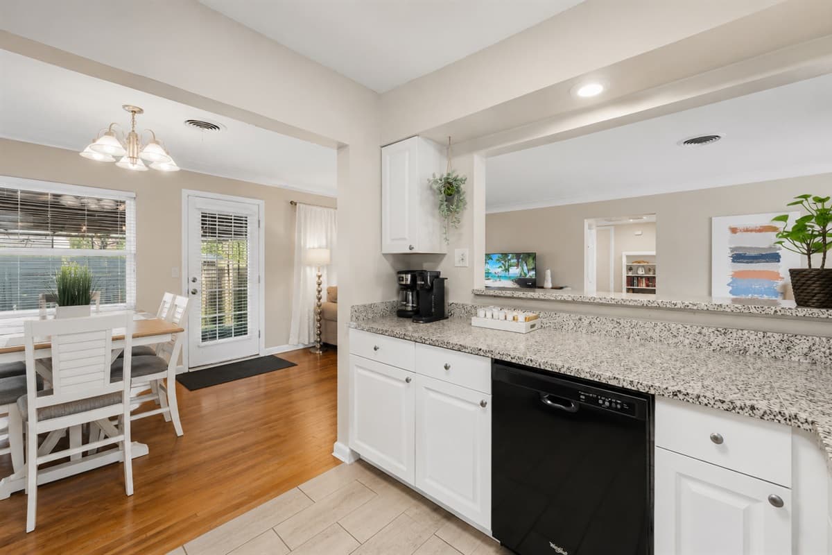 Open-concept kitchen with granite countertops and seamless access to the dining area.