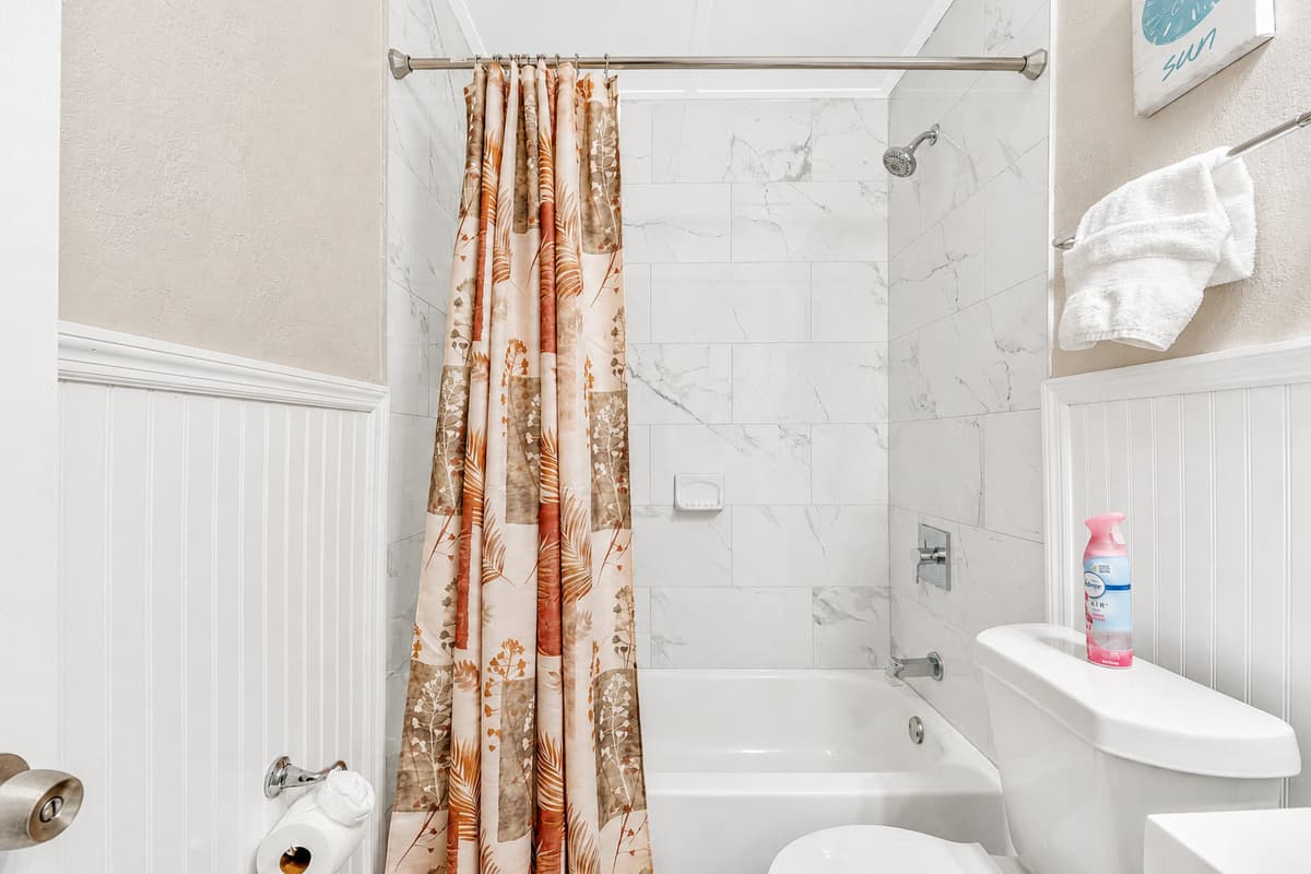 The ambiance whispers of opulence, with soft lighting casting a gentle glow on meticulously chosen fixtures and decor.