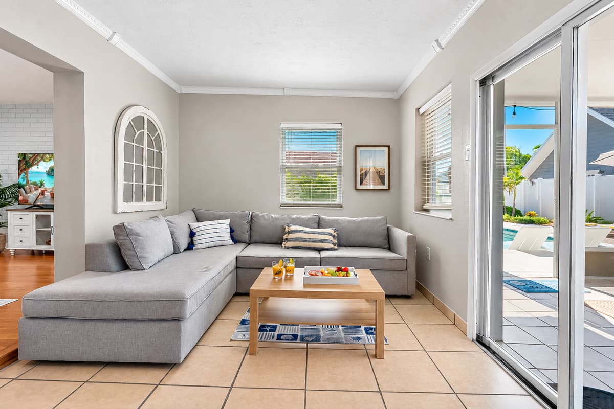 Kick back in comfort after a day of exploring—the space is tailored for relaxation with a large TV, soft lighting, and comfortable seating.