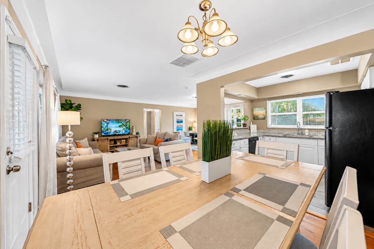 Stylish dining area with seating for the group and an open-concept layout connecting to the kitchen and living room.