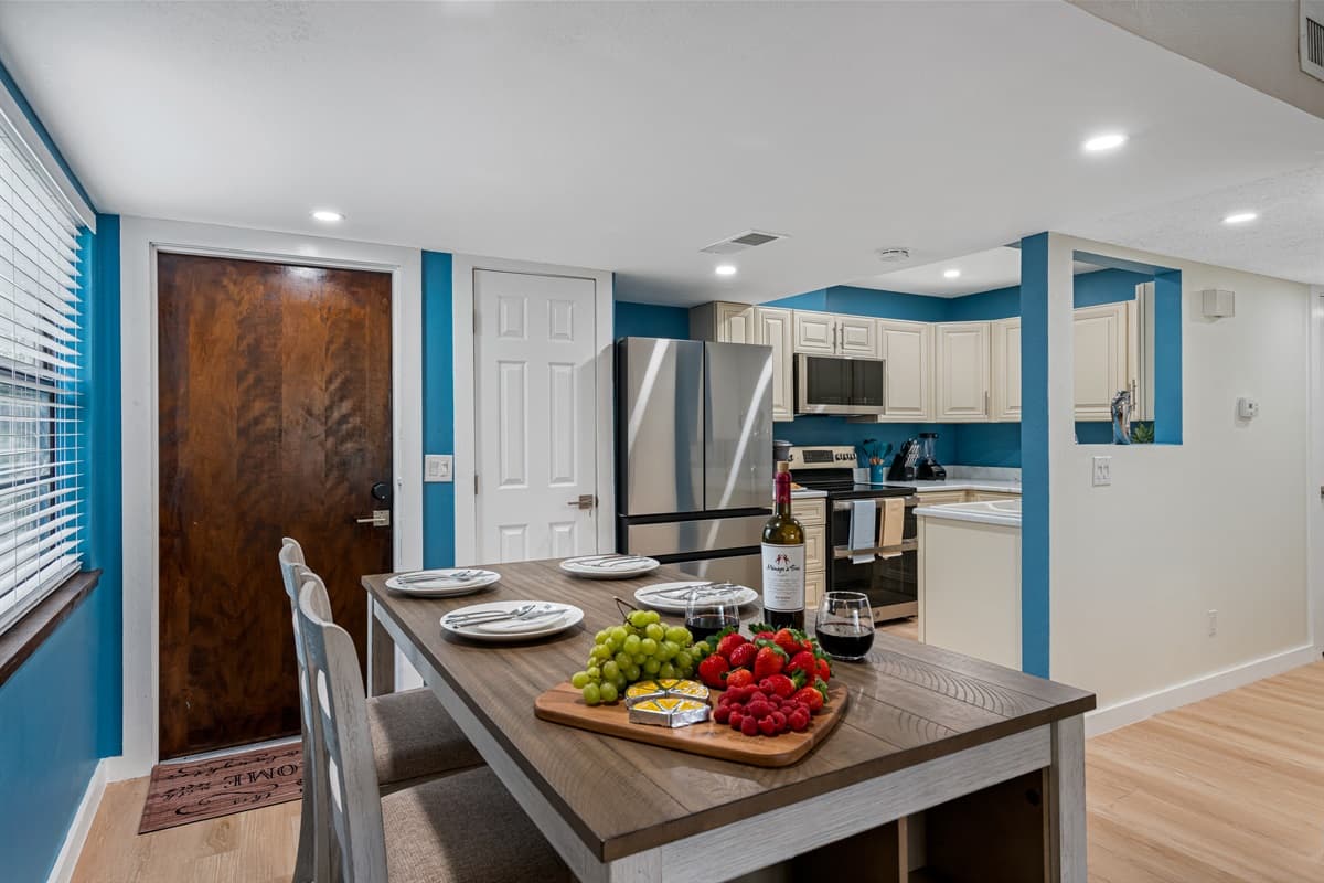 Surrounded by comfortable chairs, the dining table creates an intimate setting that encourages engaging conversations and shared moments of laughter and joy.